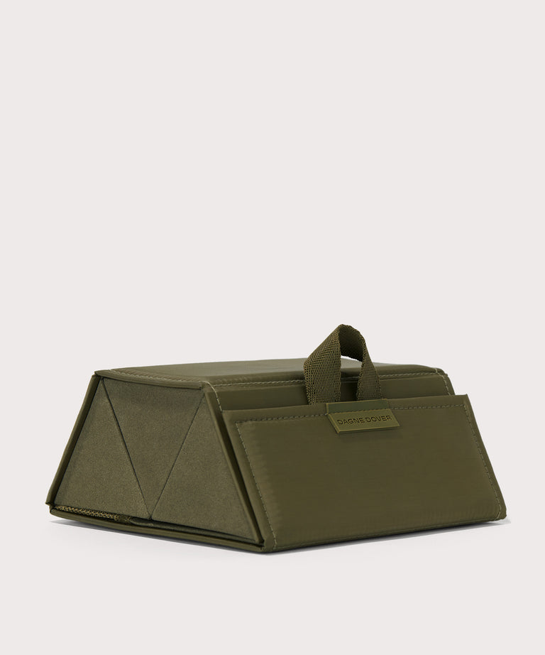 Dagne Dover Remi foldable glasses holder in dark green seen from an angle.
