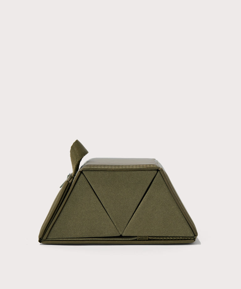 Dagne Dover Remi foldable glasses holder in dark green seen from the side.
