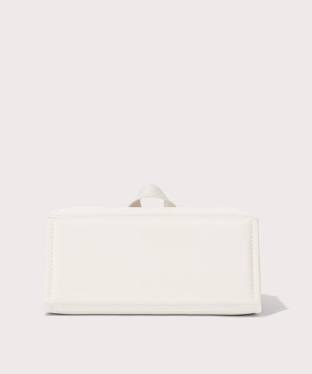 Dagne Dover Remi foldable glasses holder in white seen from the back.
