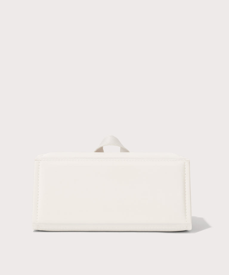 Dagne Dover Remi foldable glasses holder in white seen from the back.
