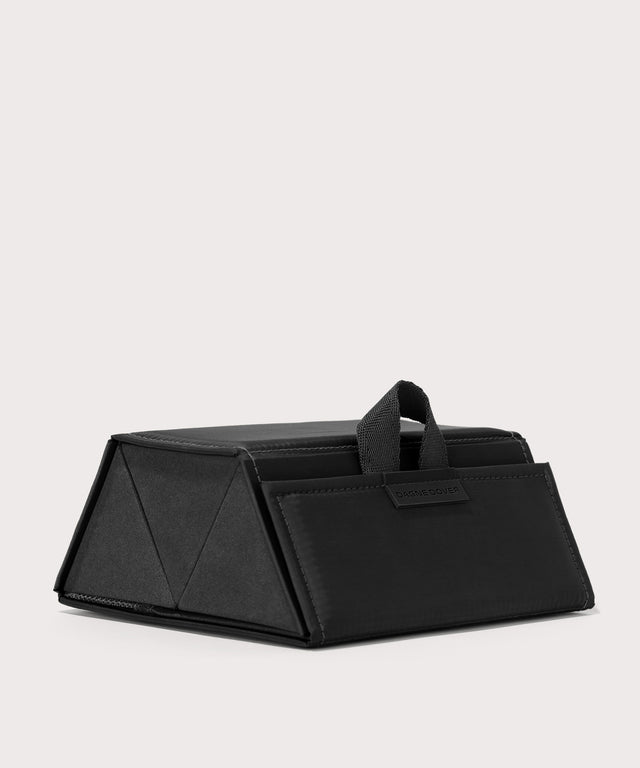 Dagne Dover Remi foldable glasses holder in black seen from an angle.
