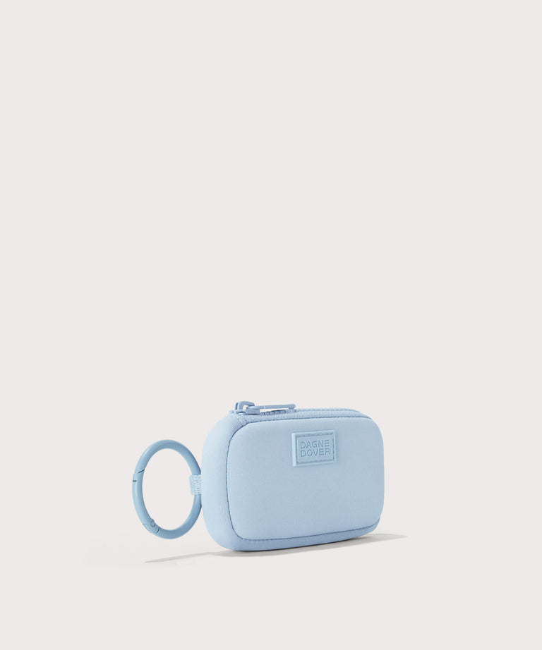 Dagne Dover Mara Keychain in an airy, lighter sky blue seen from an angle.
