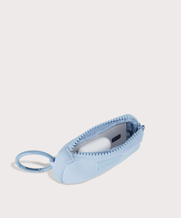 Dagne Dover Mara Keychain in an airy, lighter sky blue unzipped, showing interior.
