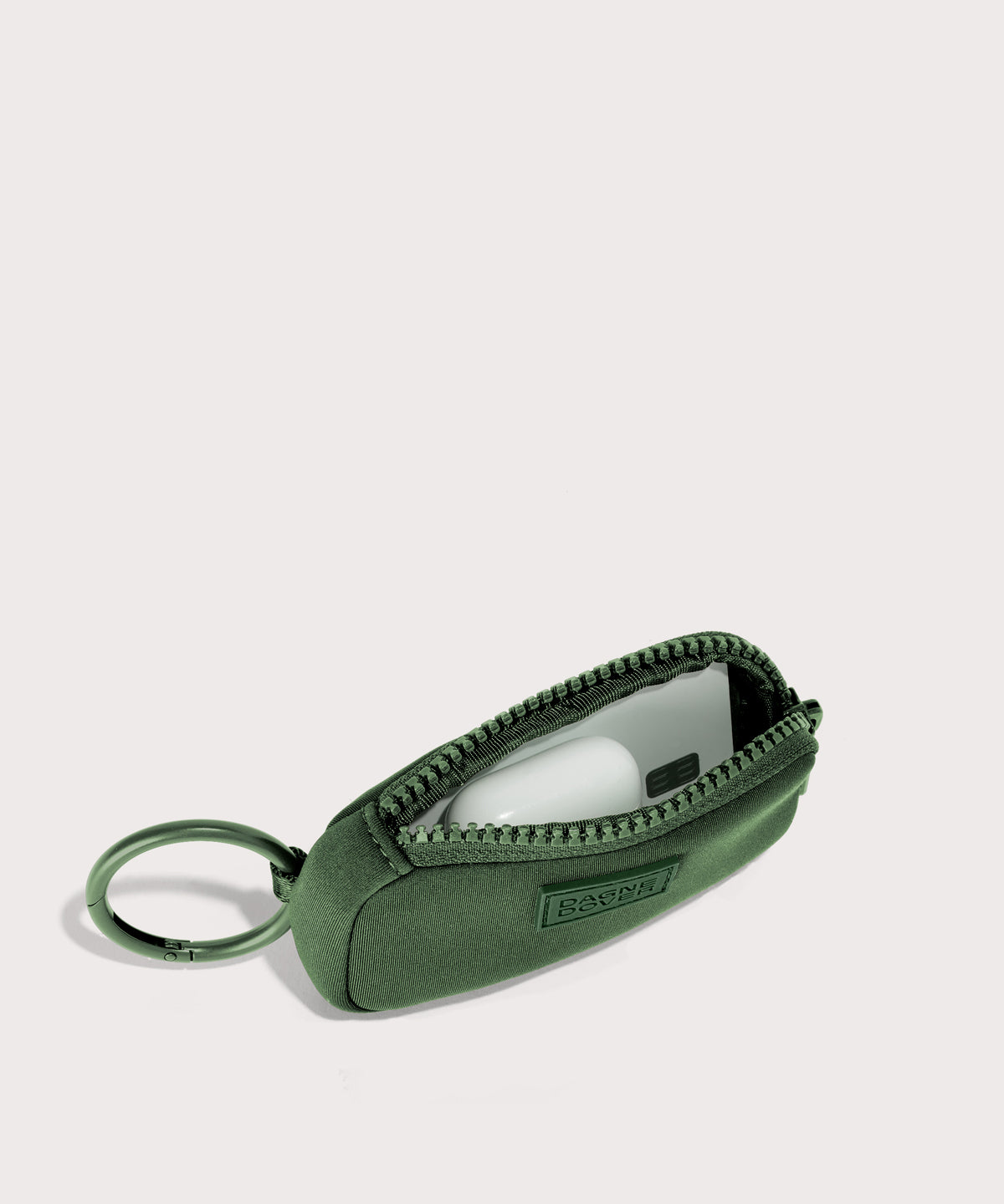 Dagne Dover Mara Keychain in a rich, classic forest green unzipped, showing interior.

