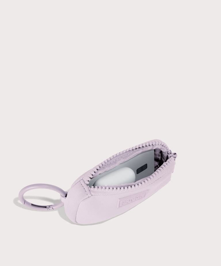 Dagne Dover Mara Keychain in a soft purple with grey undertones unzipped, showing interior.

