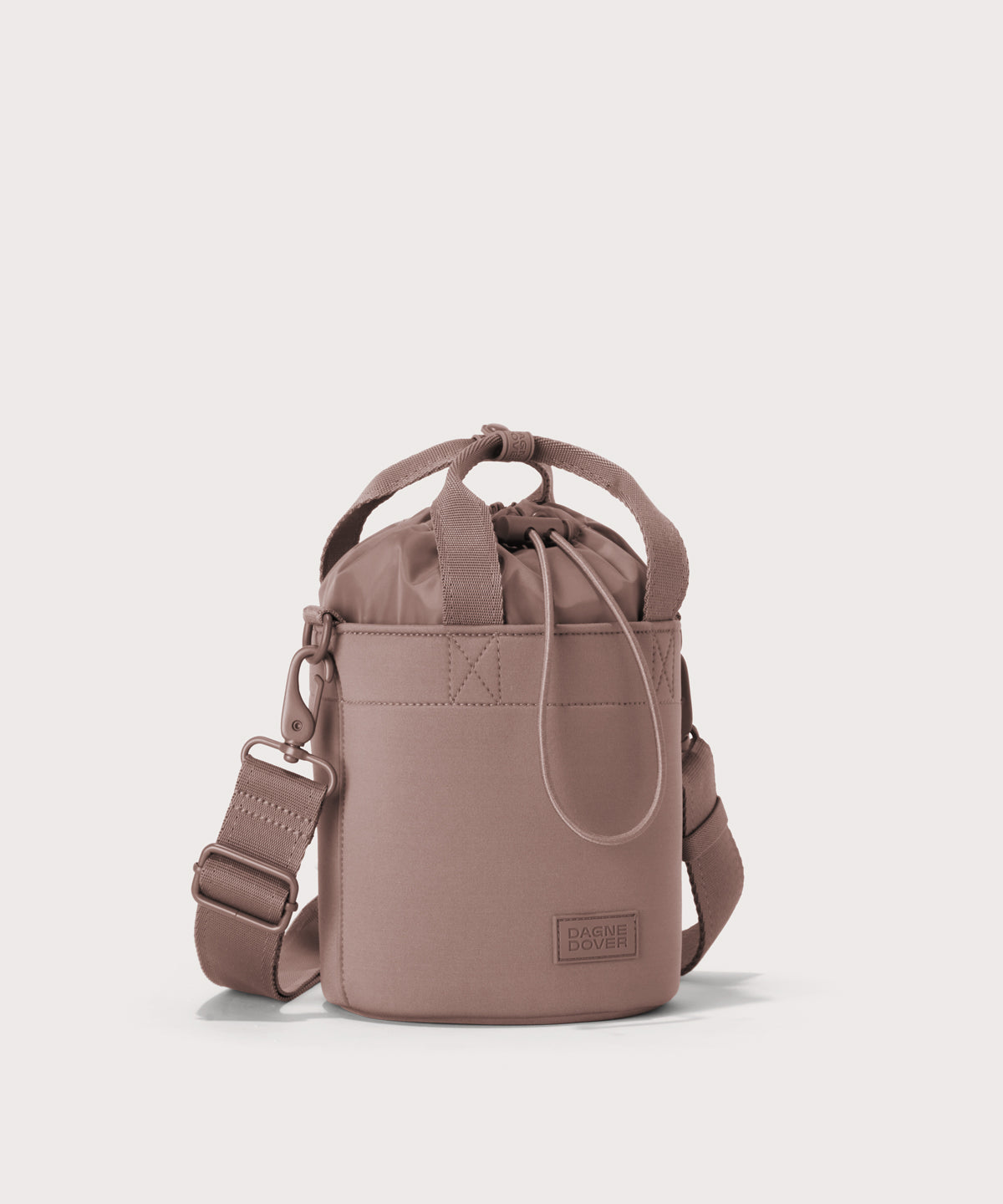 Dagne Dover Nico Bucket Bag in pink, side angle.
