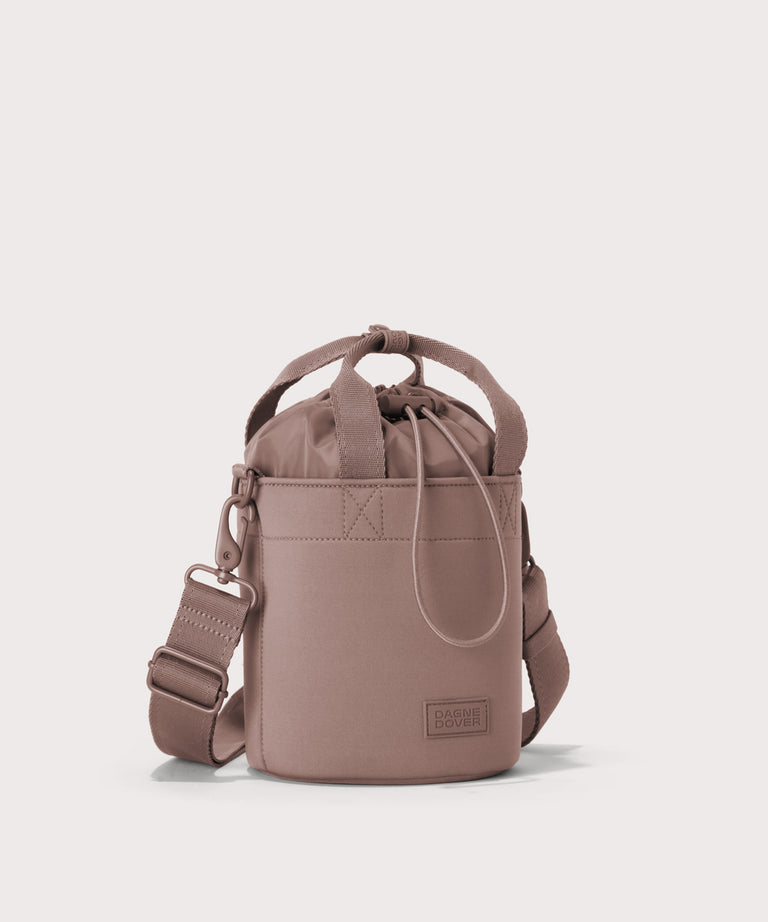 Dagne Dover Nico Bucket Bag in pink, side angle.
