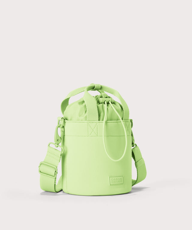 Dagne Dover Nico Bucket Bag in matcha, side angle.
