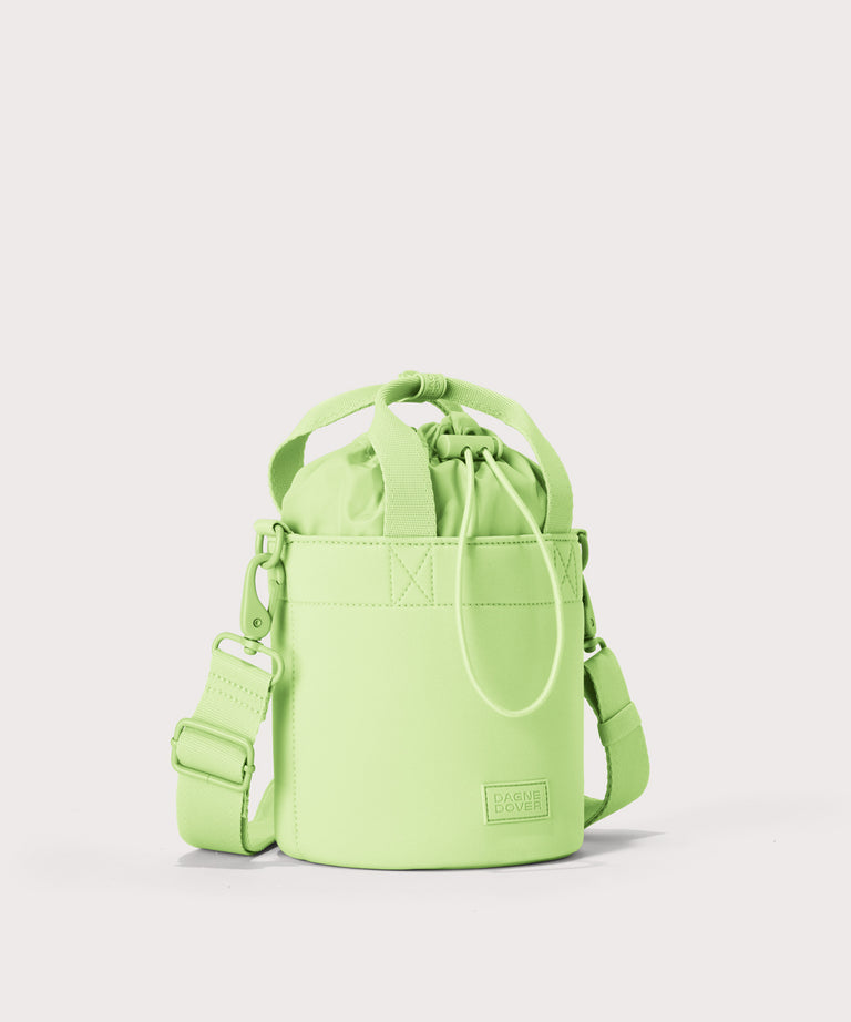 Dagne Dover Nico Bucket Bag in matcha, side angle.
