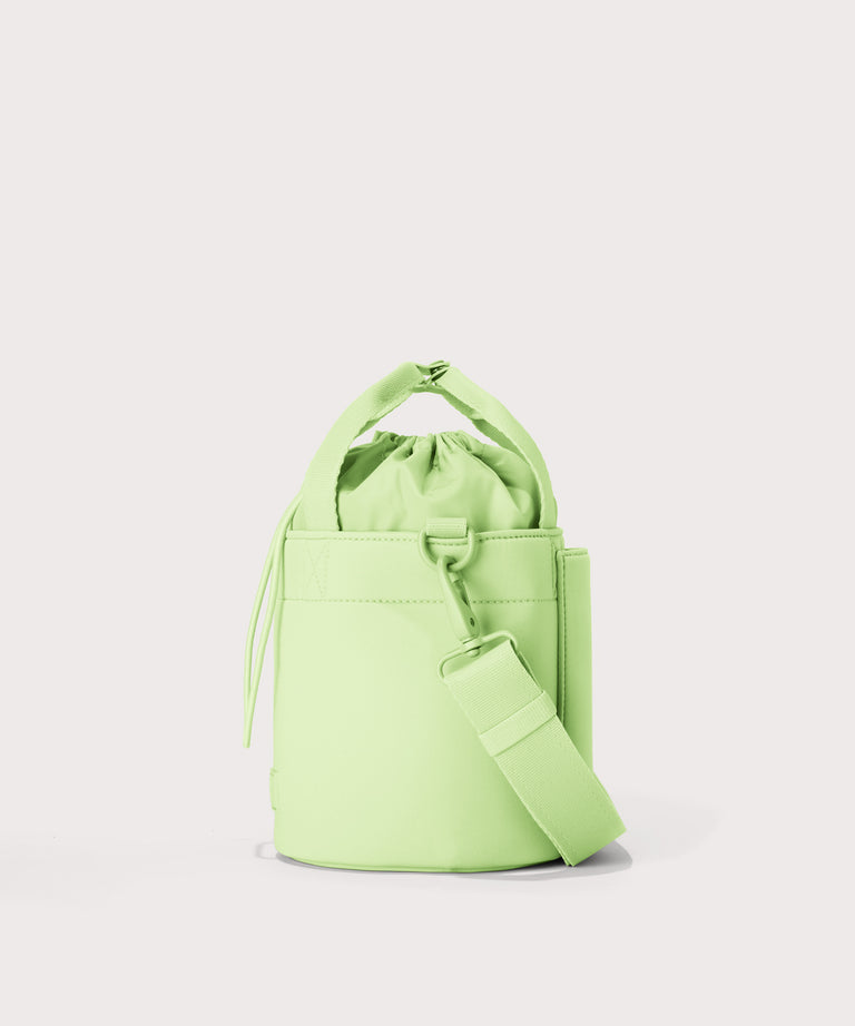 Dagne Dover Nico Bucket Bag in matcha, side angle.

