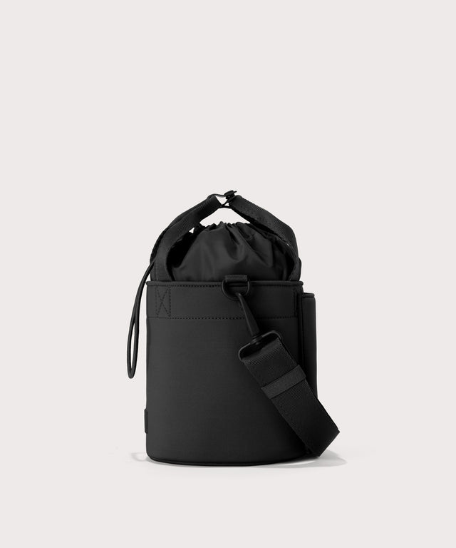 Dagne Dover Nico Bucket Bag in black, side angle.

