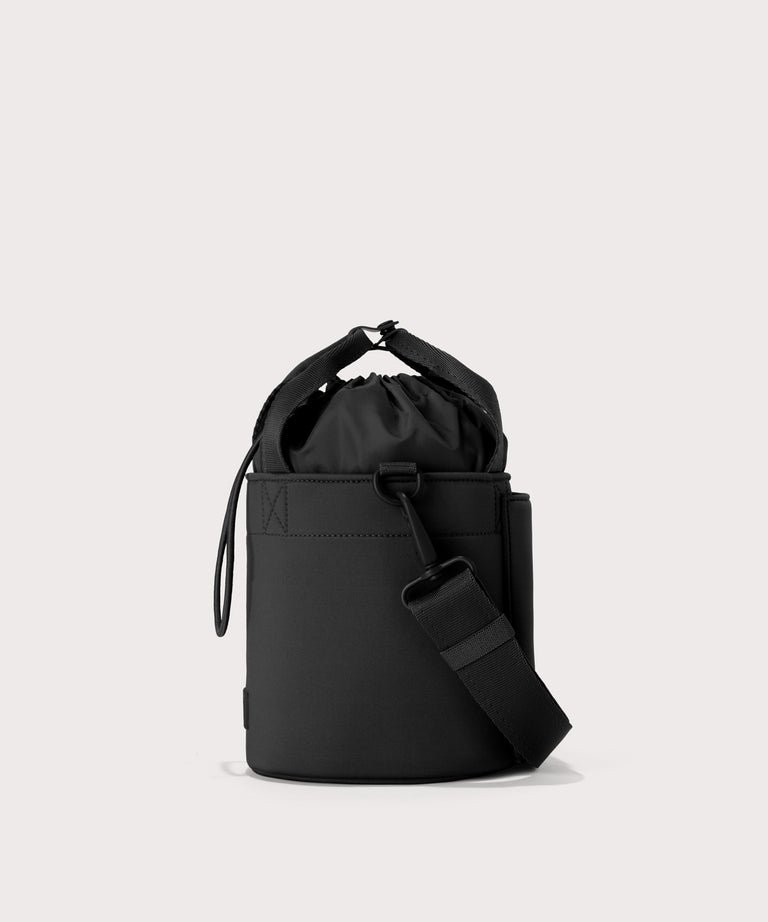 Dagne Dover Nico Bucket Bag in black, side angle.
