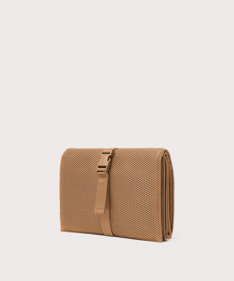 Dagne Dover Joey Changing Kit in camel brown seen from an angle.
