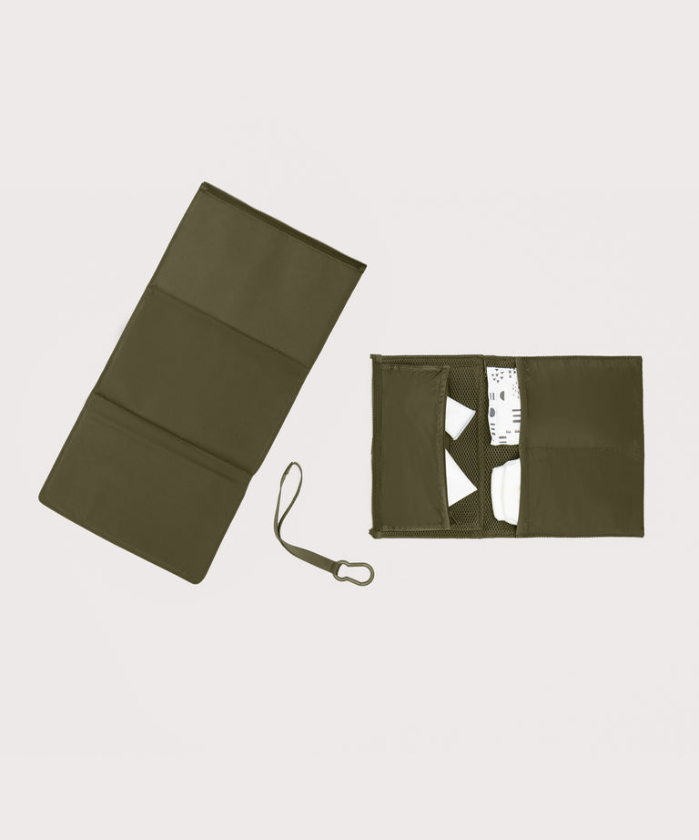 Dagne Dover Joey Changing Kit in dark moss unfolded, revealing the detachable changing mat.
