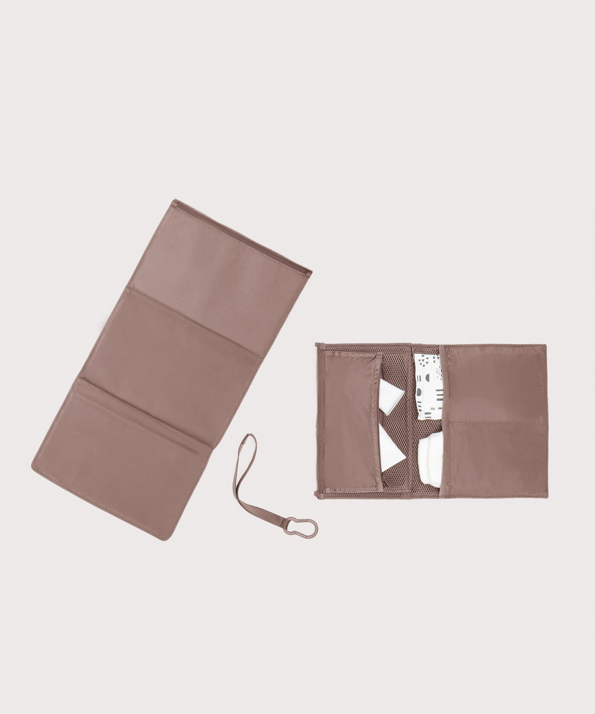 Dagne Dover Joey Changing Kit in pink unfolded, revealing the detachable changing mat.
