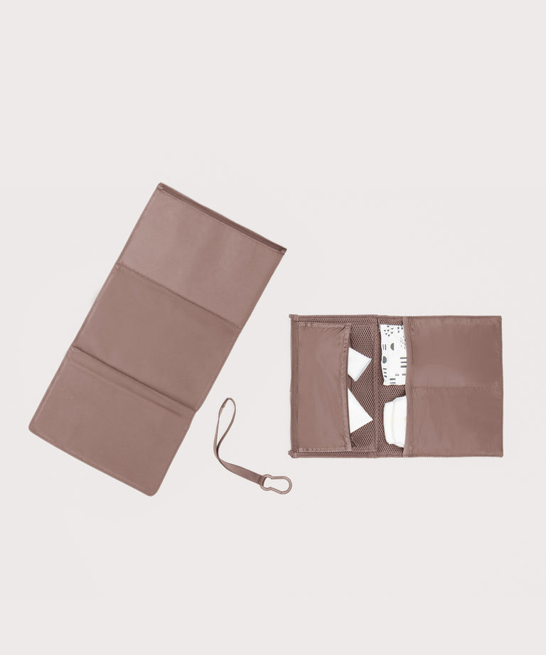 Dagne Dover Joey Changing Kit in pink unfolded, revealing the detachable changing mat.
