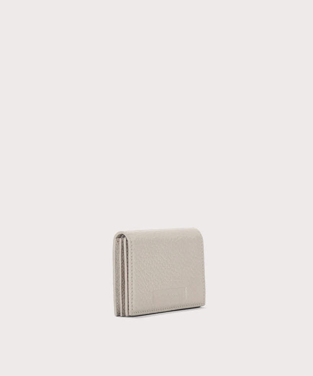 Dagne Dover Accordion Card Case in white seen from an angle.