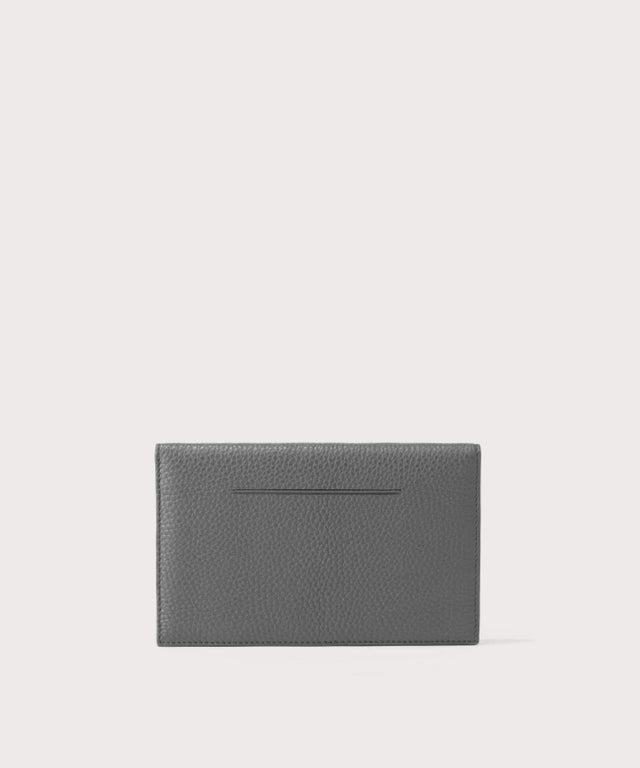 Dagne Dover Accordion Travel Wallet in grey, revealing the external card slot.
