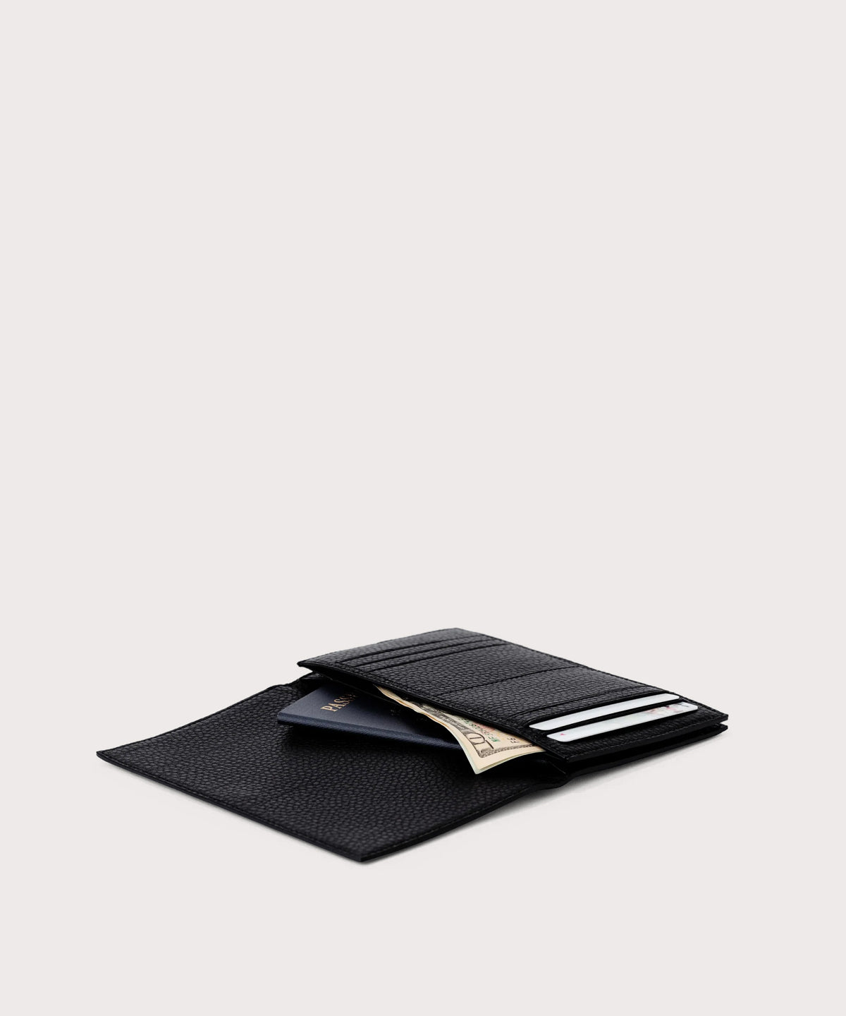 hover - Dagne Dover Accordion Travel Wallet in black opened, revealing the internal card slots and internal gusseted card and passport slots.