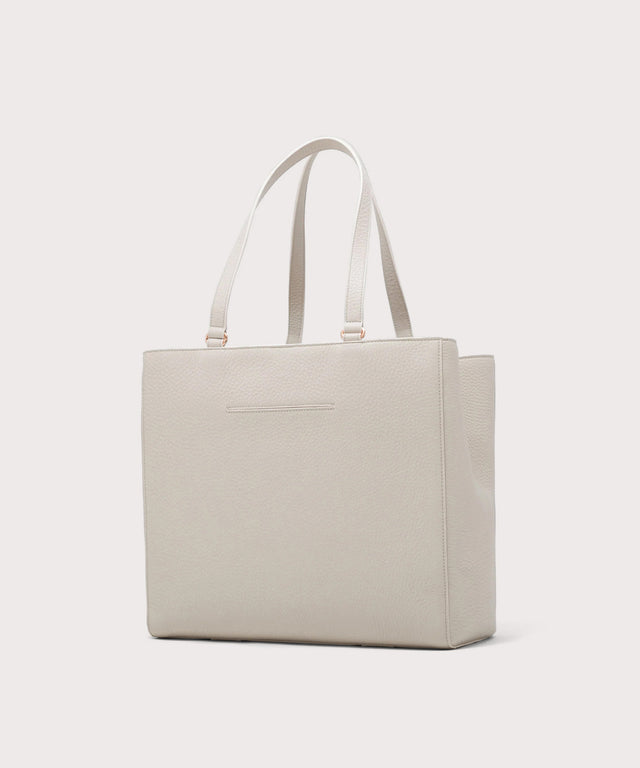 Dagne Dover large Allyn Tote in grey with the exterior slip pocket.
