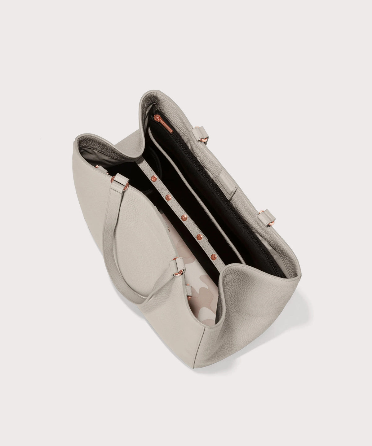 Dagne Dover large Allyn Tote in grey seen from above, revealing the interior slip pockets and laptop sleeve.
