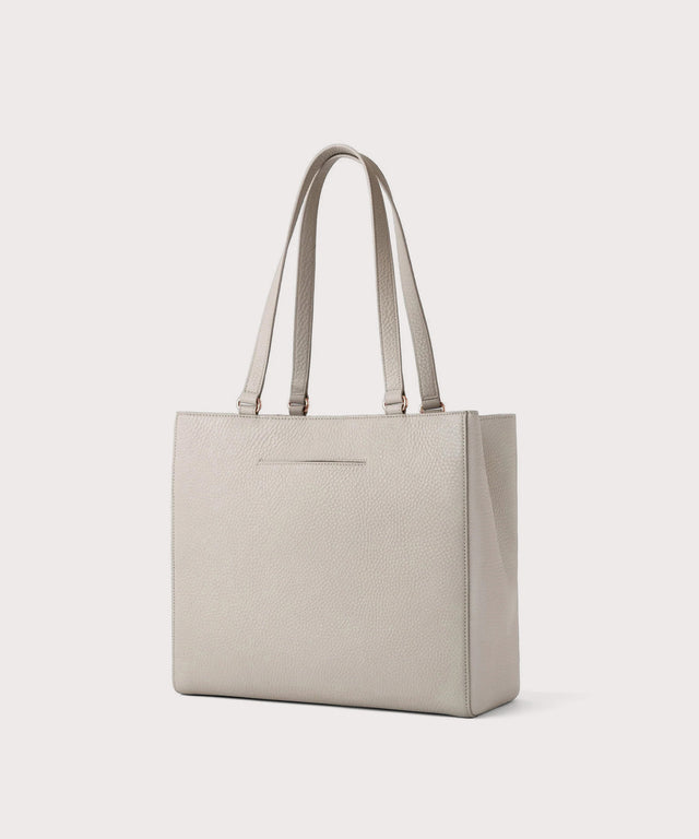 Dagne Dover medium Allyn Tote in light grey with the exterior slip pocket.
