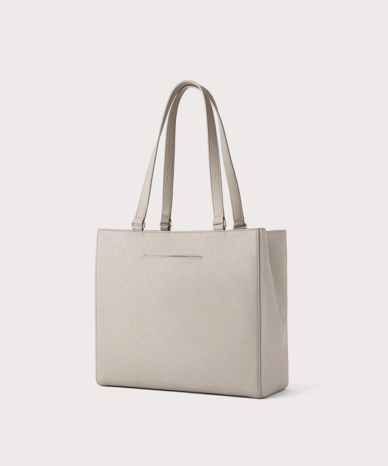 Dagne Dover medium Allyn Tote in light grey with the exterior slip pocket.
