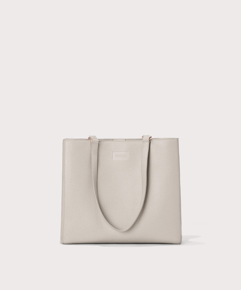 Dagne Dover medium Allyn Tote in light grey seen from the front.
