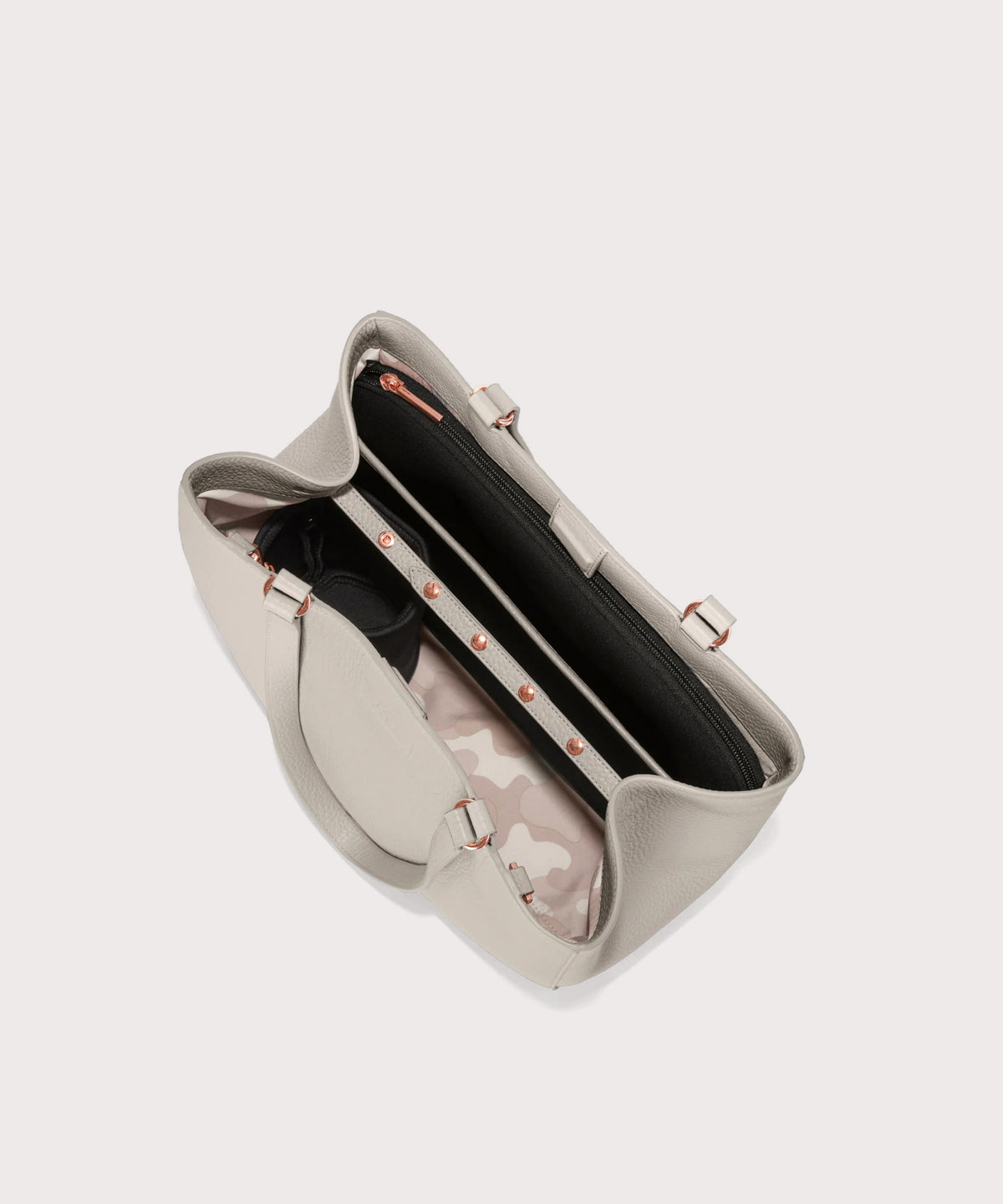 Dagne Dover medium Allyn Tote in light grey seen from above, revealing the interior slip pockets and laptop sleeve.
