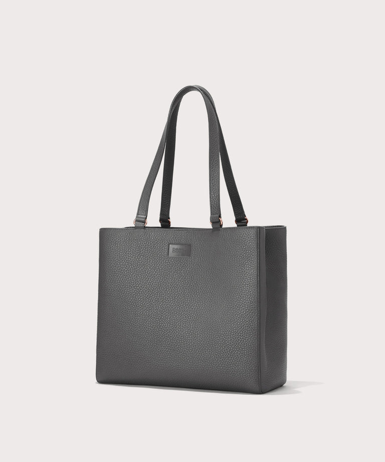 Dagne Dover medium Allyn Tote in grey seen from an angle.
