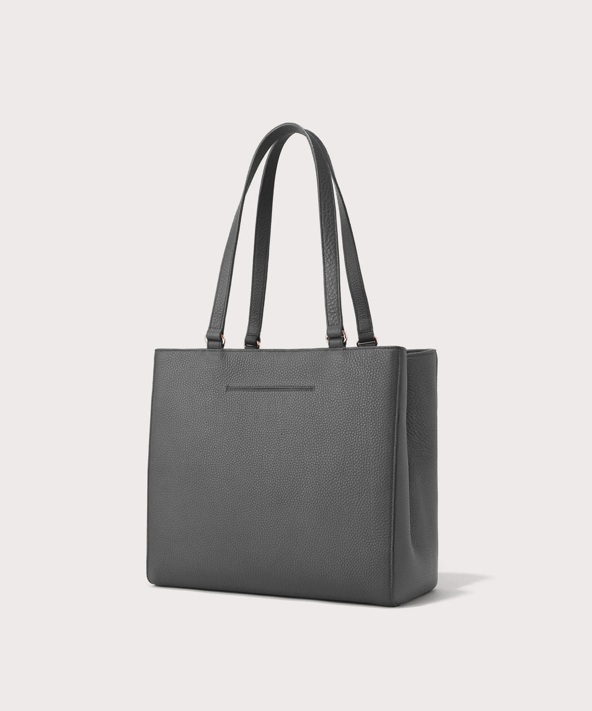 Dagne Dover medium Allyn Tote in grey with the exterior slip pocket.
