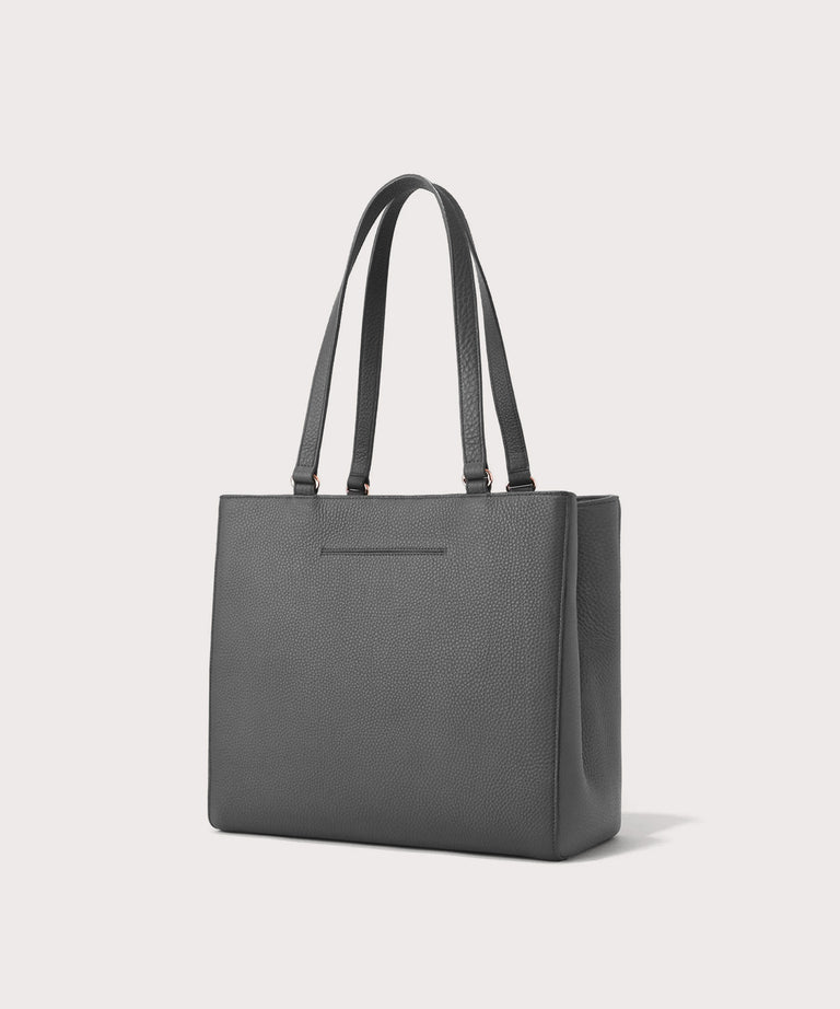 Dagne Dover medium Allyn Tote in grey with the exterior slip pocket.
