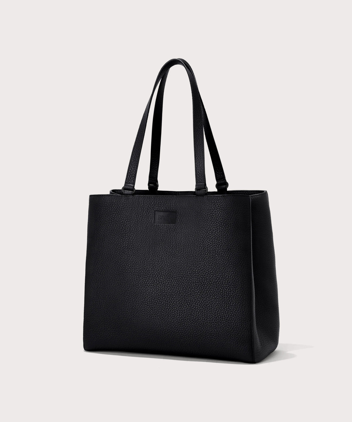 Dagne Dover large Allyn Tote in black seen from an angle.
