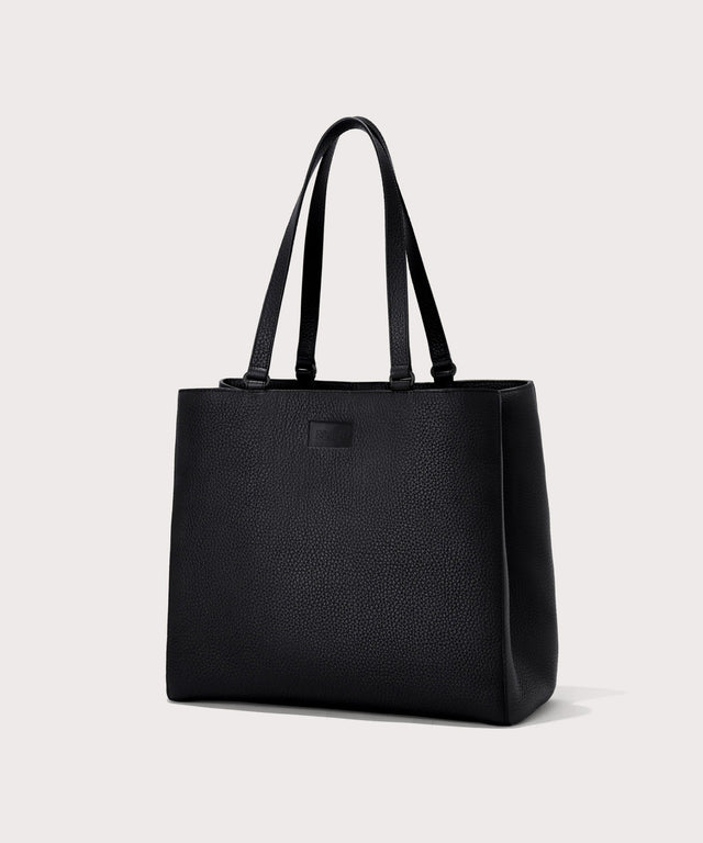Dagne Dover large Allyn Tote in black seen from an angle.

