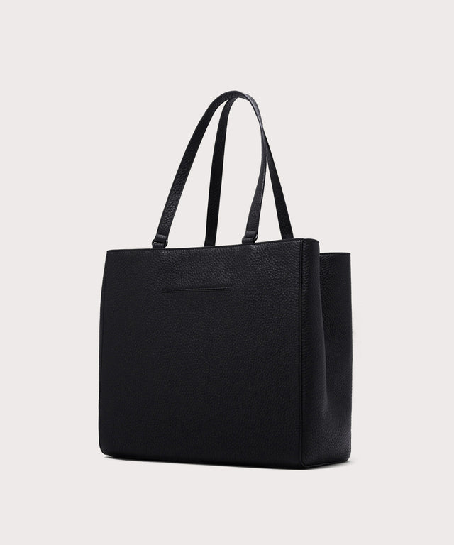 Dagne Dover large Allyn Tote in black with the exterior slip pocket.
