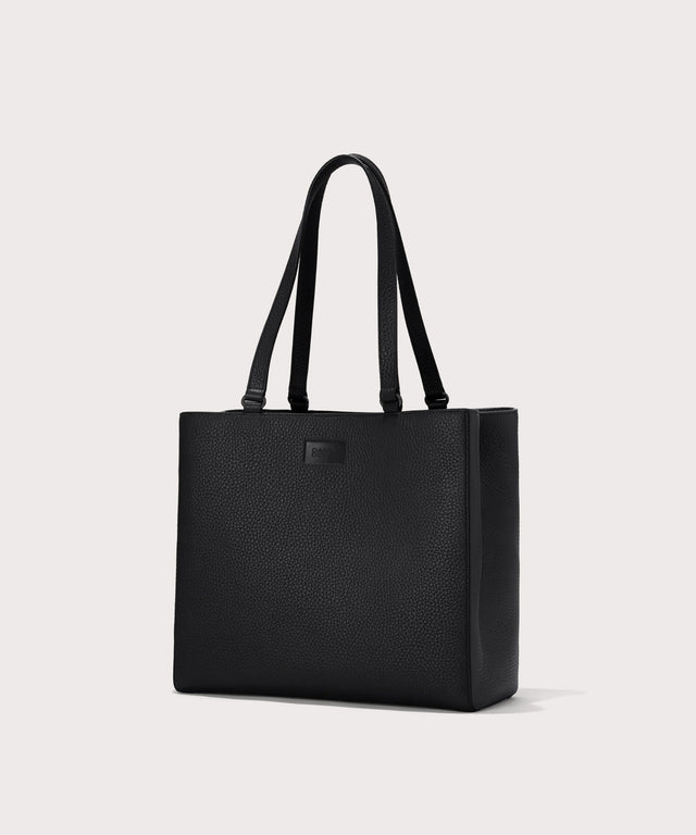 Dagne Dover medium Allyn Tote in black seen from an angle.
