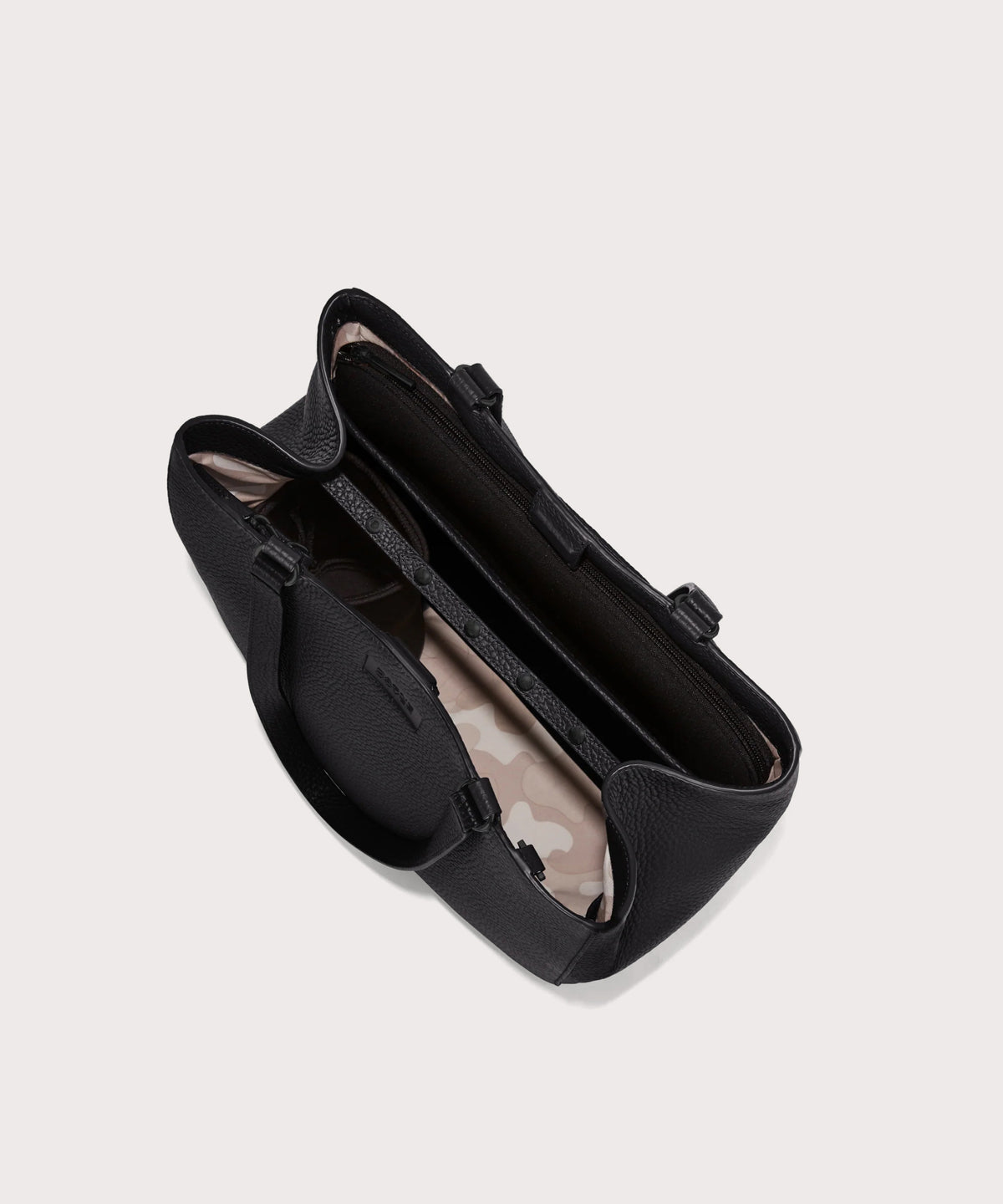 Dagne Dover medium Allyn Tote in black seen from above, revealing the interior slip pockets and laptop sleeve.
