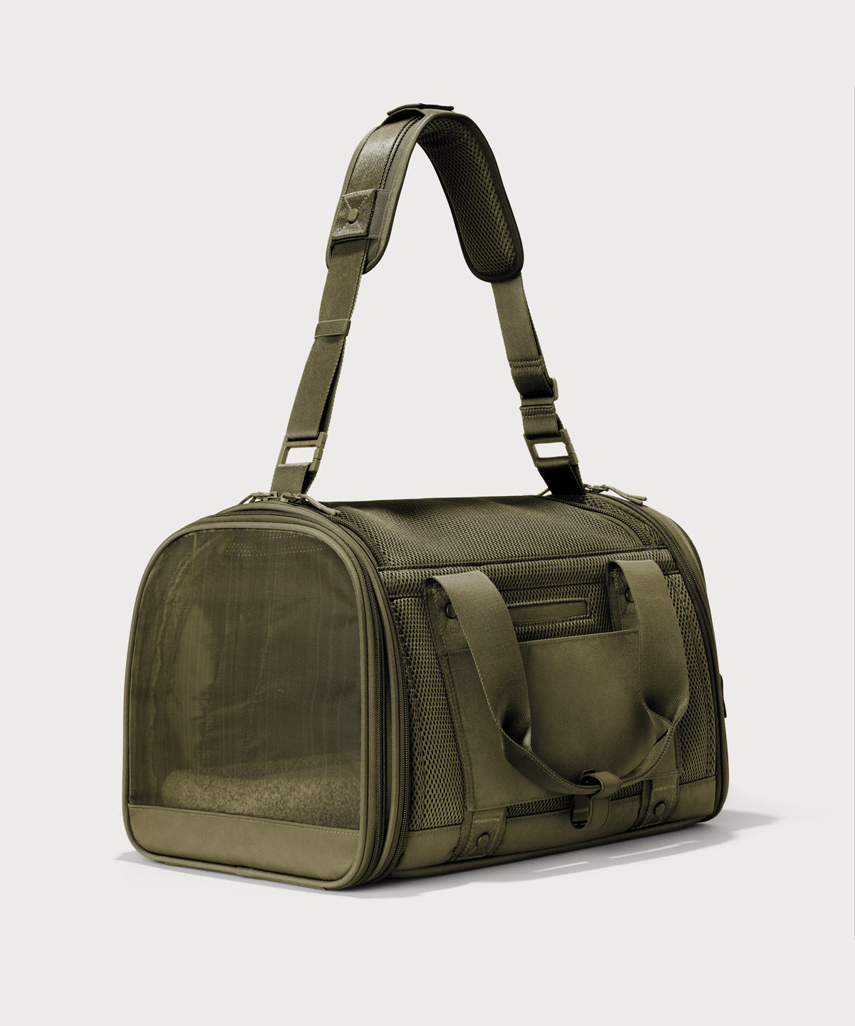 Dagne Dover Large Kyoto Pet Carrier in a deep olive green seen from a back angle with crossbody strap.
