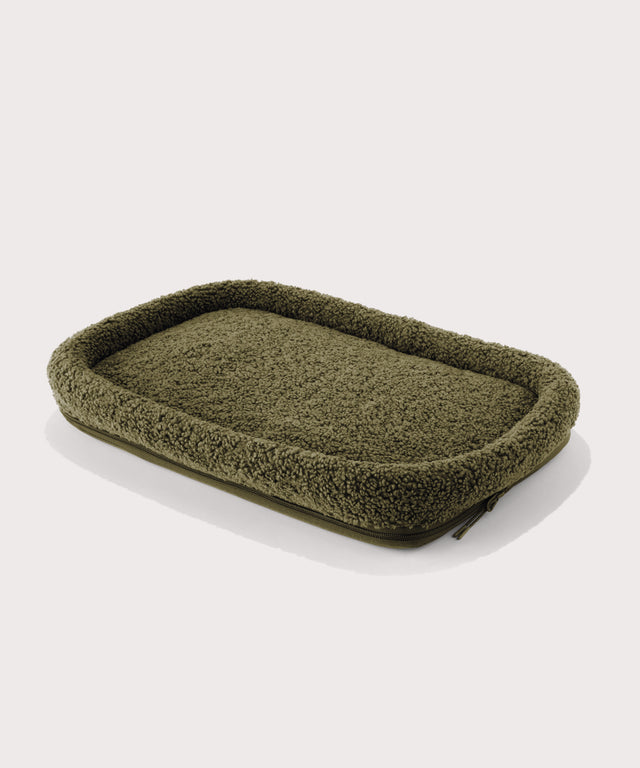 Dagne Dover Large Kyoto Pet Carrier removable padded faux sherpa pet bed in a deep olive green.
