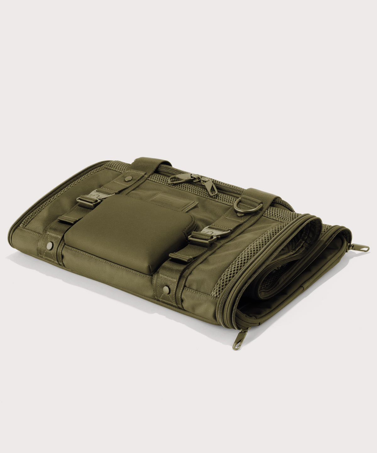 Dagne Dover Large Kyoto Pet Carrier in a deep olive green folded flat.
