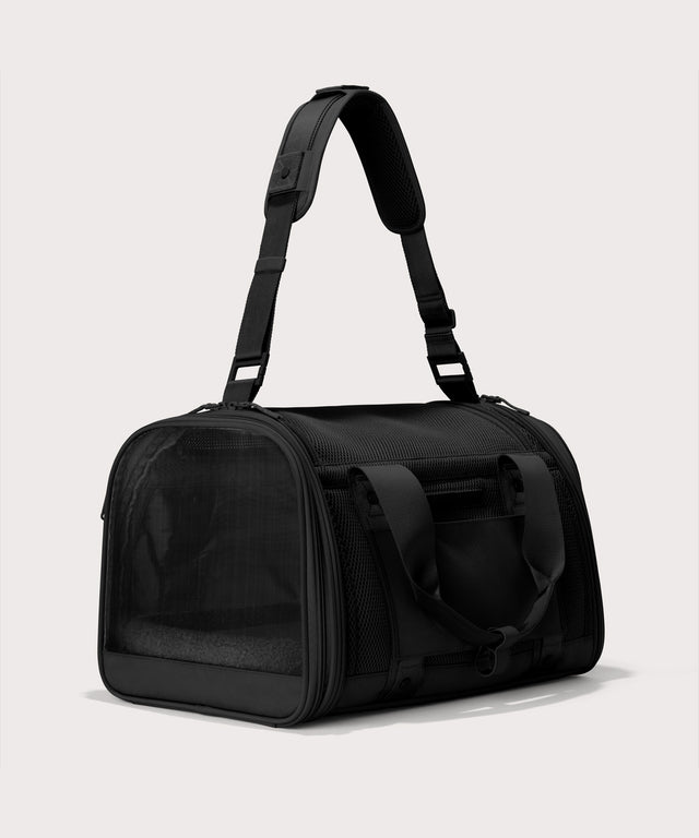 Dagne Dover Large Kyoto Pet Carrier in black seen from a back angle with crossbody strap.
