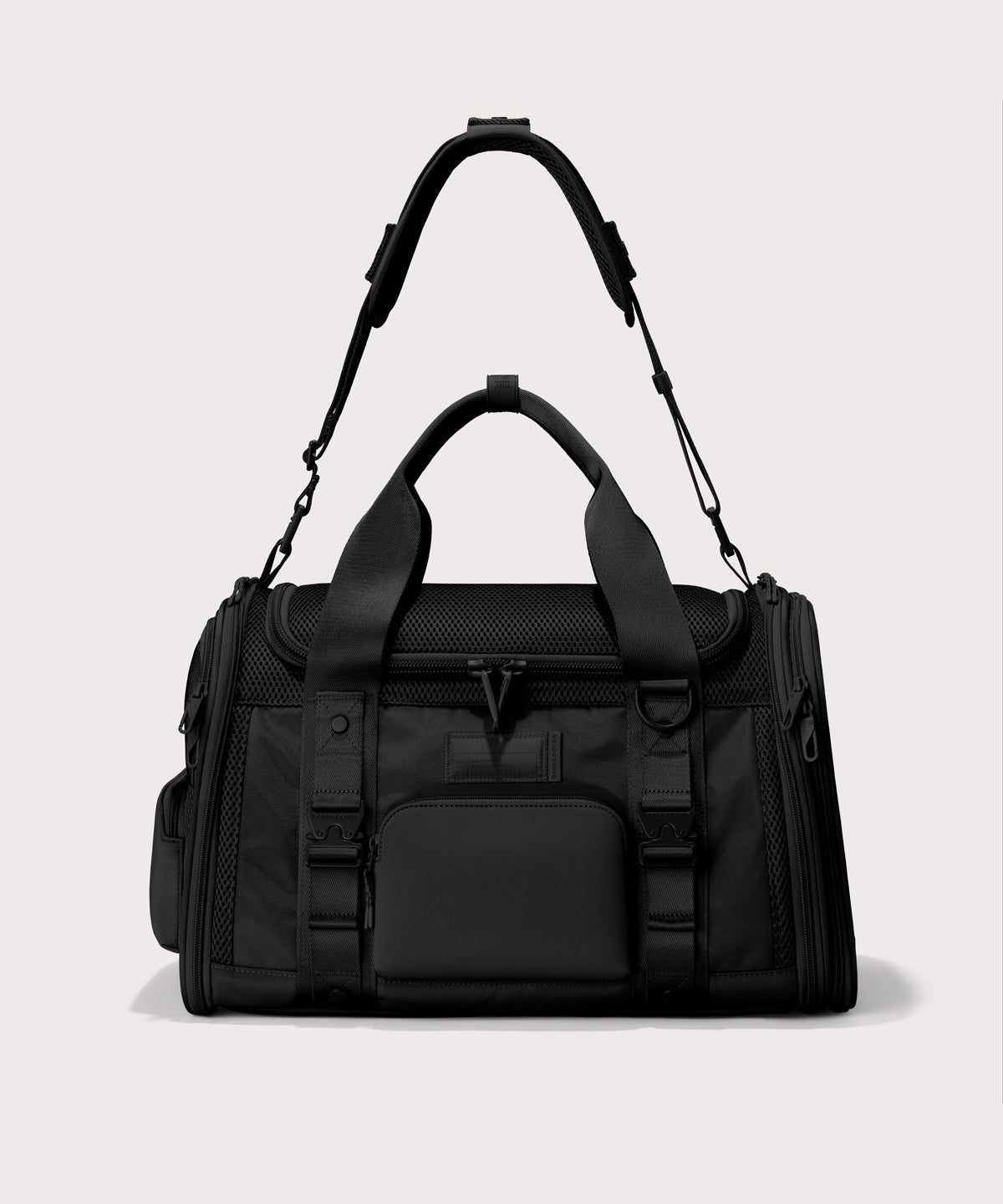 Dagne Dover Large Kyoto Pet Carrier in black seen from the front with crossbody strap.
