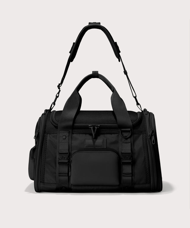 Dagne Dover Large Kyoto Pet Carrier in black seen from the front with crossbody strap.
