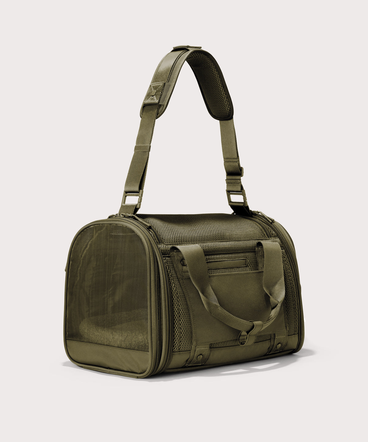 Dagne Dover small Kyoto Pet Carrier in a deep olive green seen from a back angle with crossbody strap.
