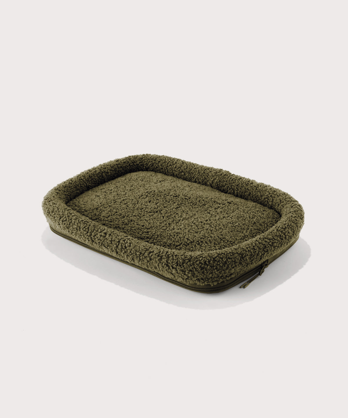 Dagne Dover small Kyoto Pet Carrier removable padded faux sherpa pet bed in a deep olive green.
