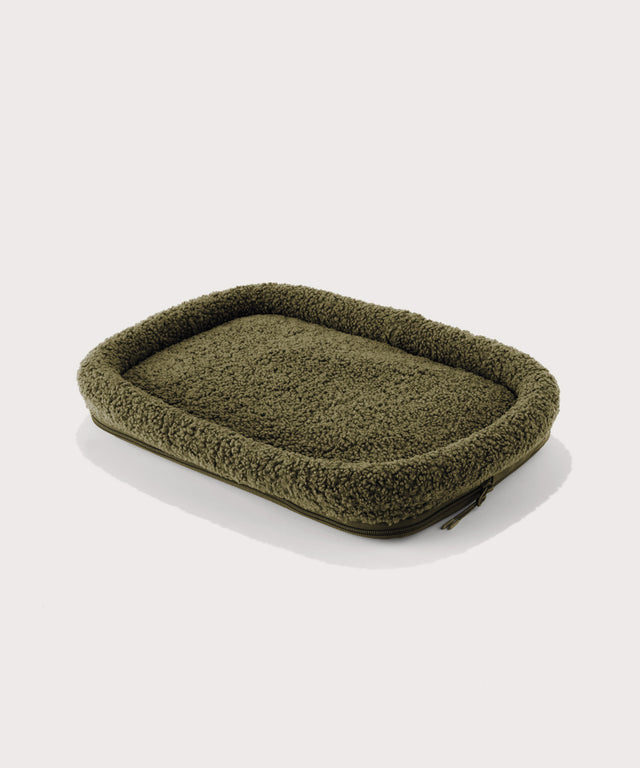 Dagne Dover small Kyoto Pet Carrier removable padded faux sherpa pet bed in a deep olive green.

