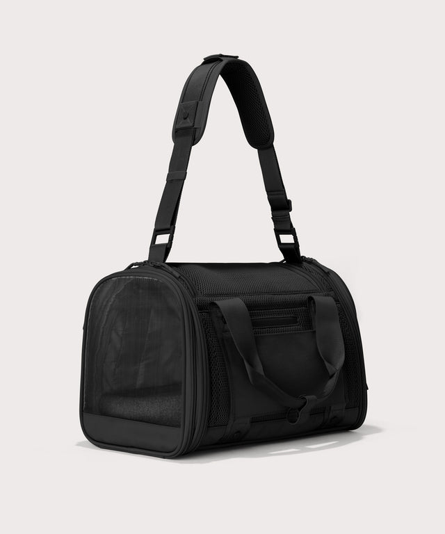Dagne Dover small Kyoto Pet Carrier in black seen from a back angle with crossbody strap.

