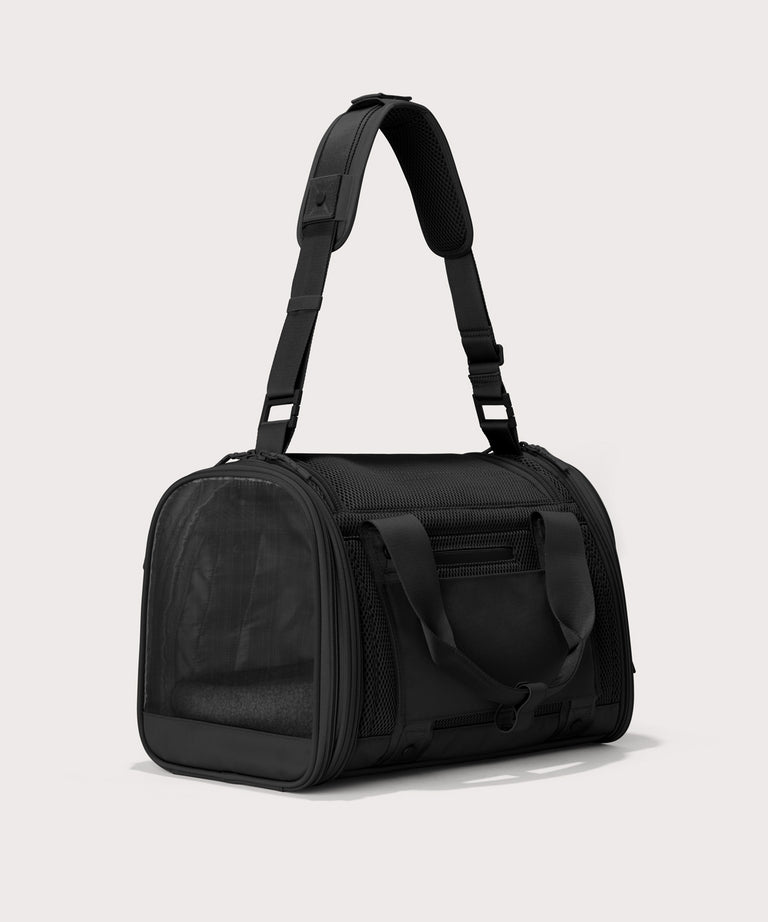 Dagne Dover small Kyoto Pet Carrier in black seen from a back angle with crossbody strap.

