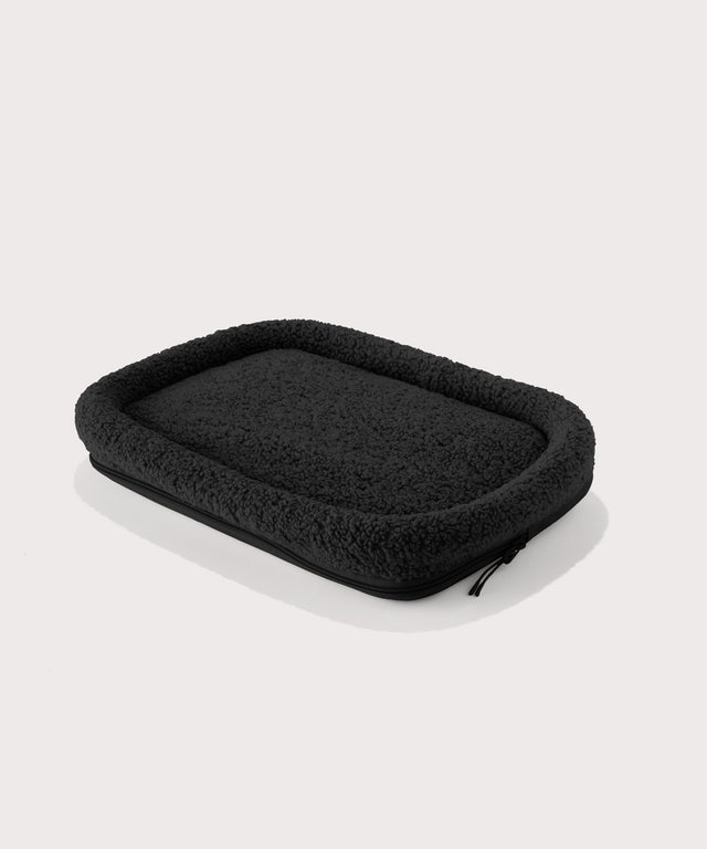 Dagne Dover small Kyoto Pet Carrier removable padded faux sherpa pet bed in black.
