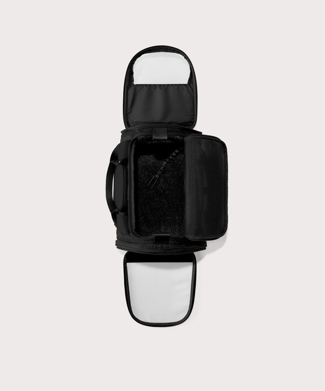 Dagne Dover small Kyoto Pet Carrier in black seen unzipped, top down view.
